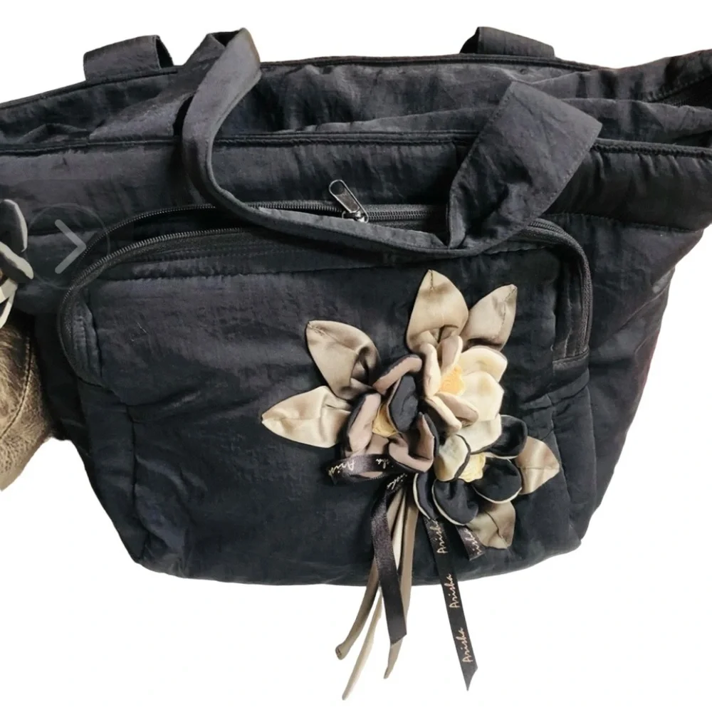 Arisha black super cute microfiber like fabric bag w/ attached flower detail